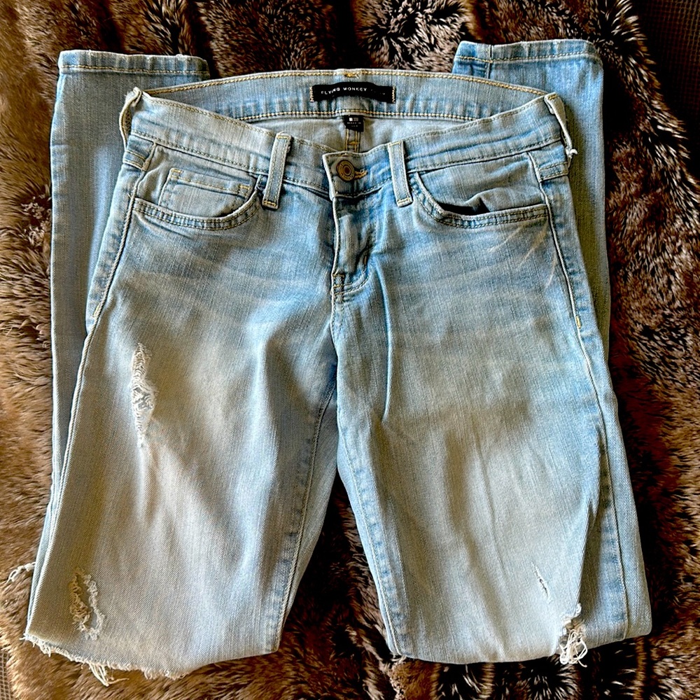 Light wash distressed skinny jeans